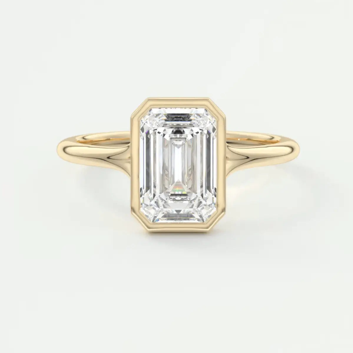 18k yellow gold emerald cut diamond engagement ring.