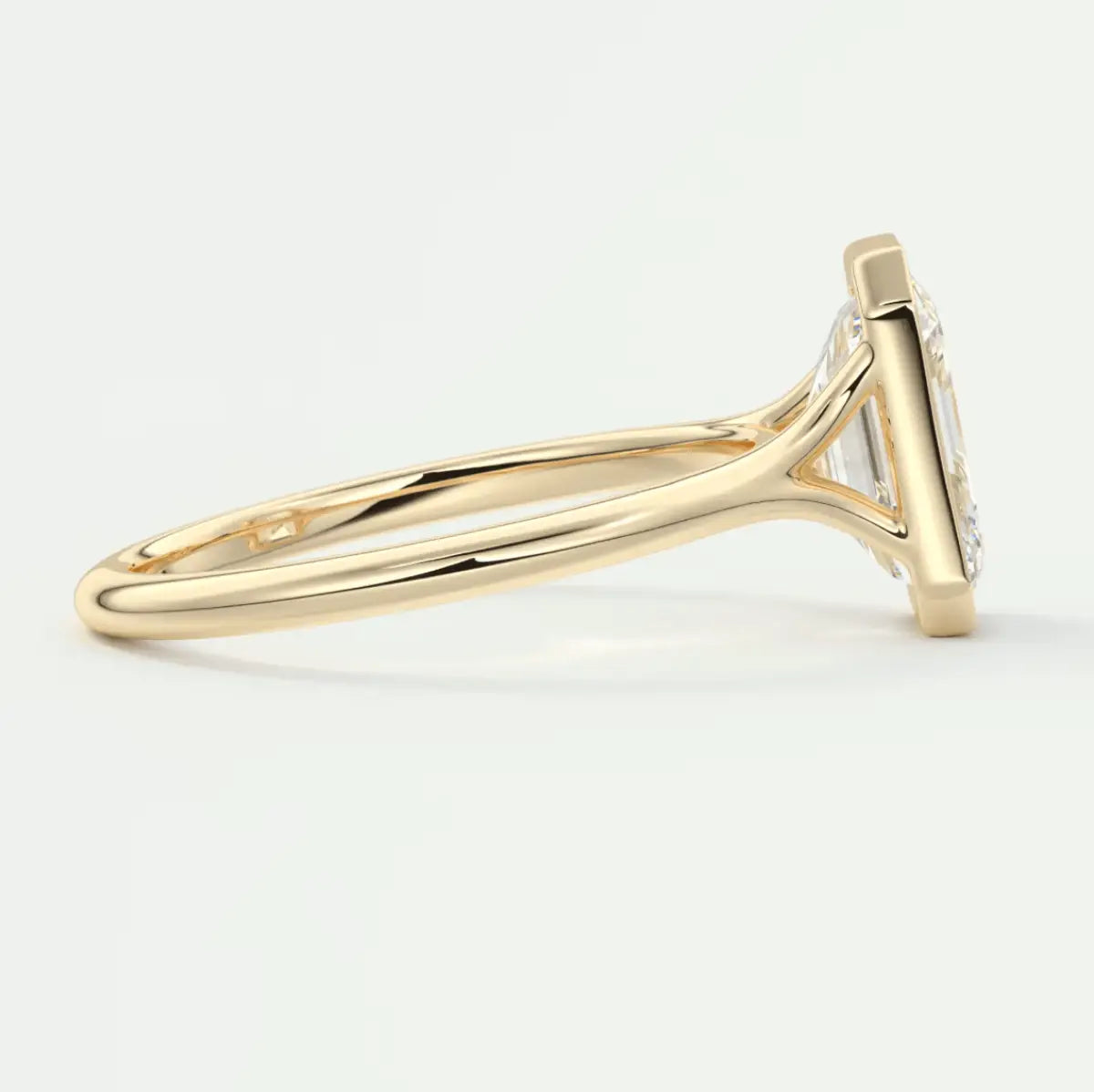 18k yellow gold diamond engagement ring with a princess cut center stone and pave set diamonds on the band.