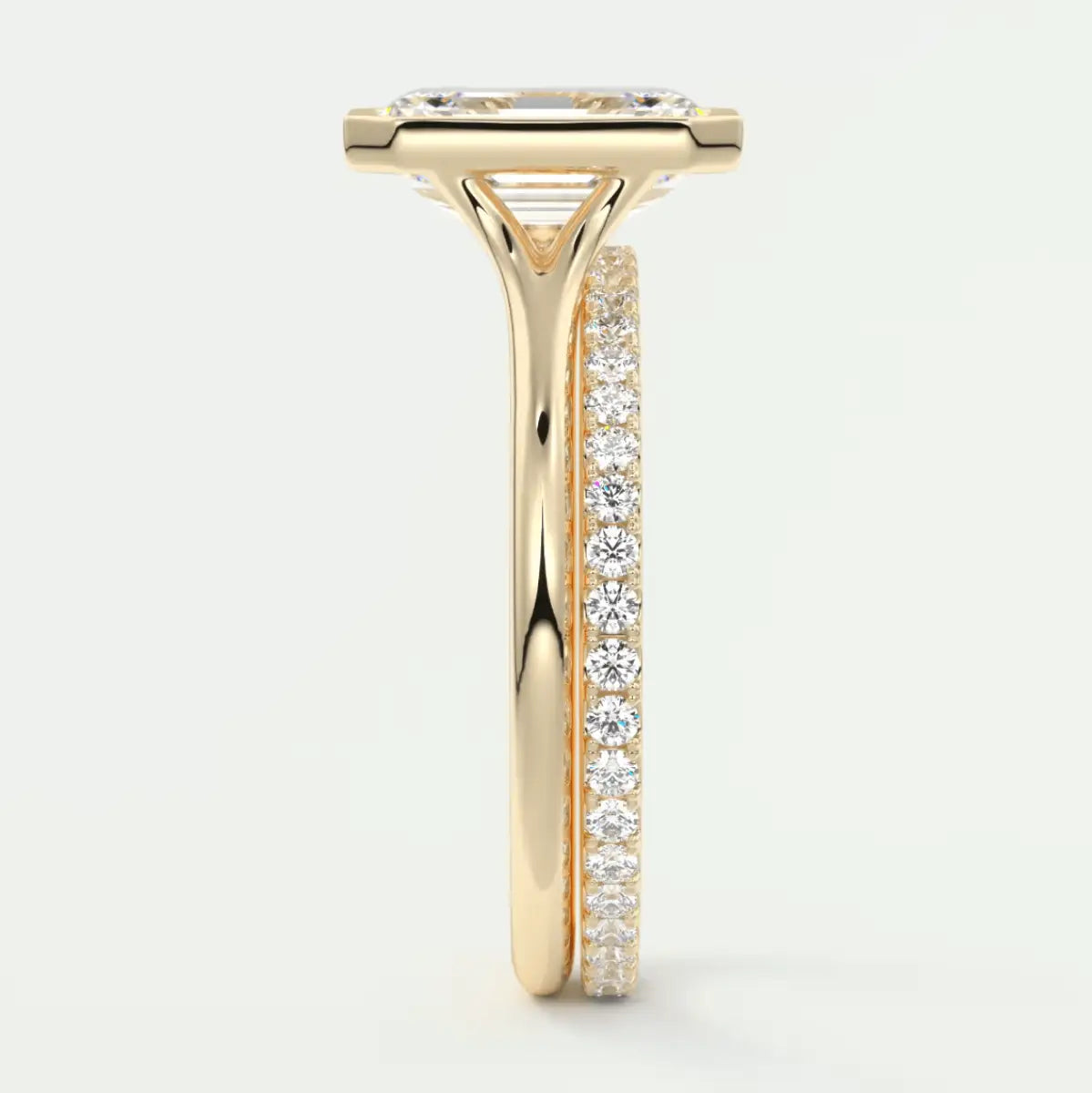 18k yellow gold diamond engagement ring with a princess cut center stone and channel set side stones.