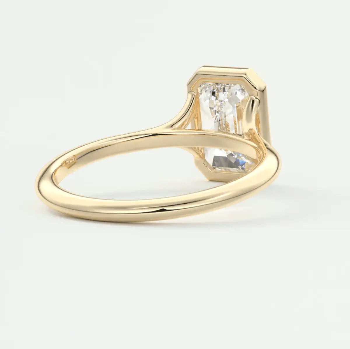 18k yellow gold engagement ring with a princess cut diamond.