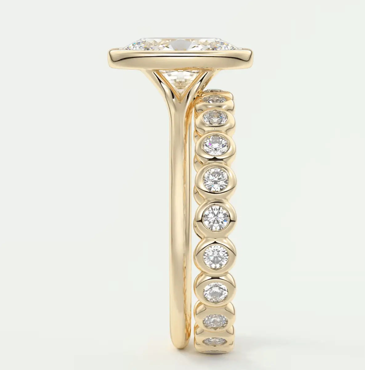 18k yellow gold diamond engagement ring with a cushion-cut center stone and channel-set diamonds on the band.