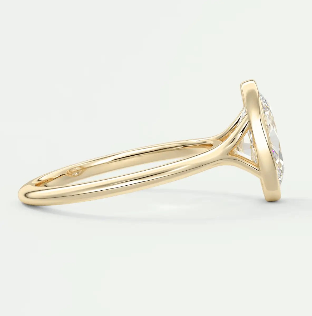 18k yellow gold diamond engagement ring with a round brilliant cut stone.