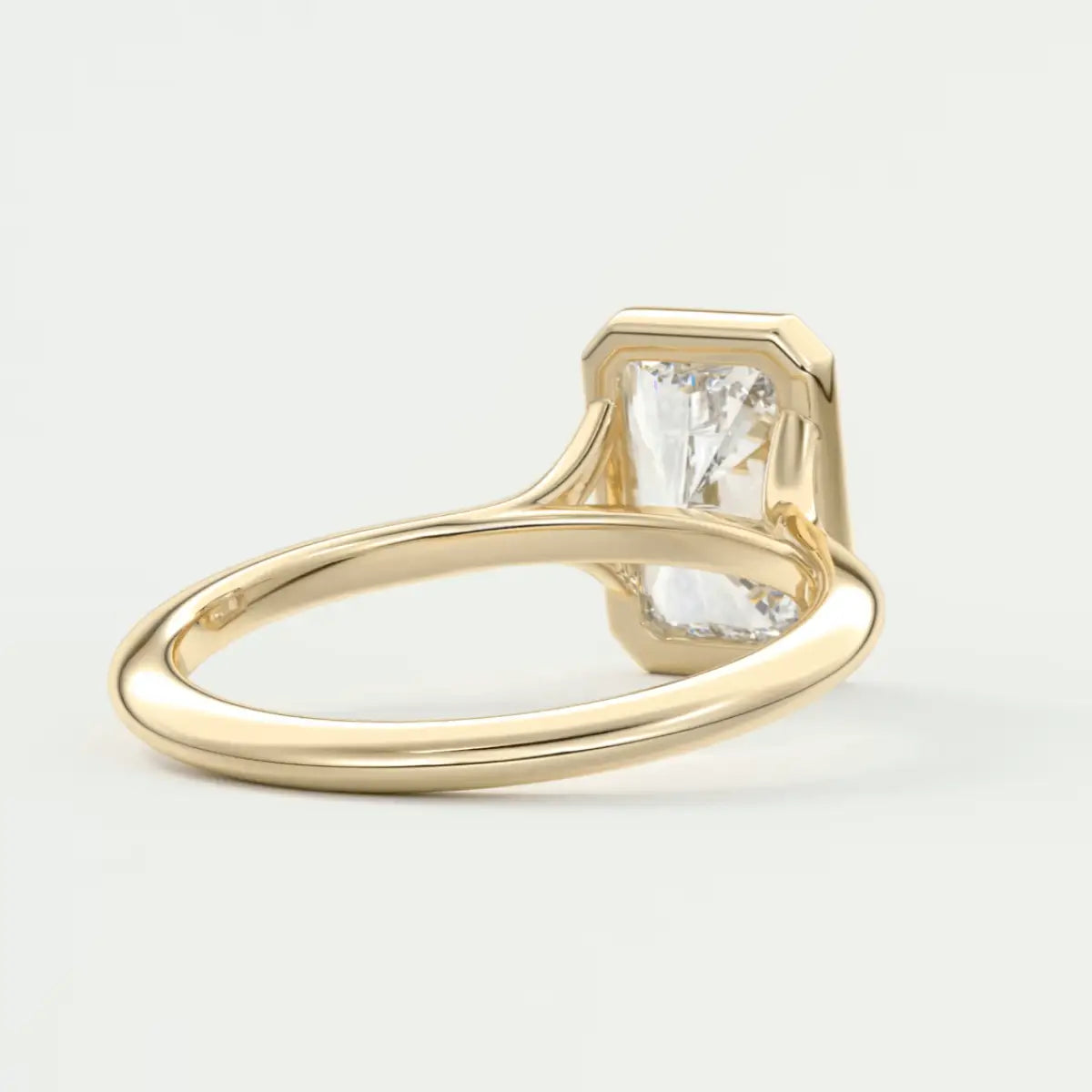 18k gold engagement ring with a princess cut diamond.