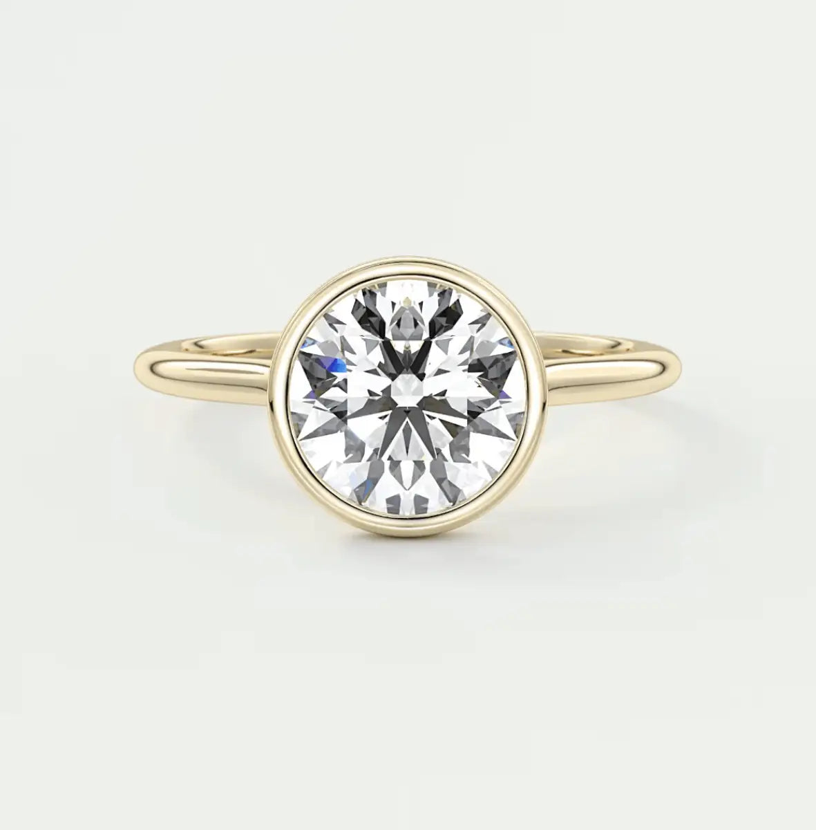 18-karat yellow gold solitaire diamond engagement ring.