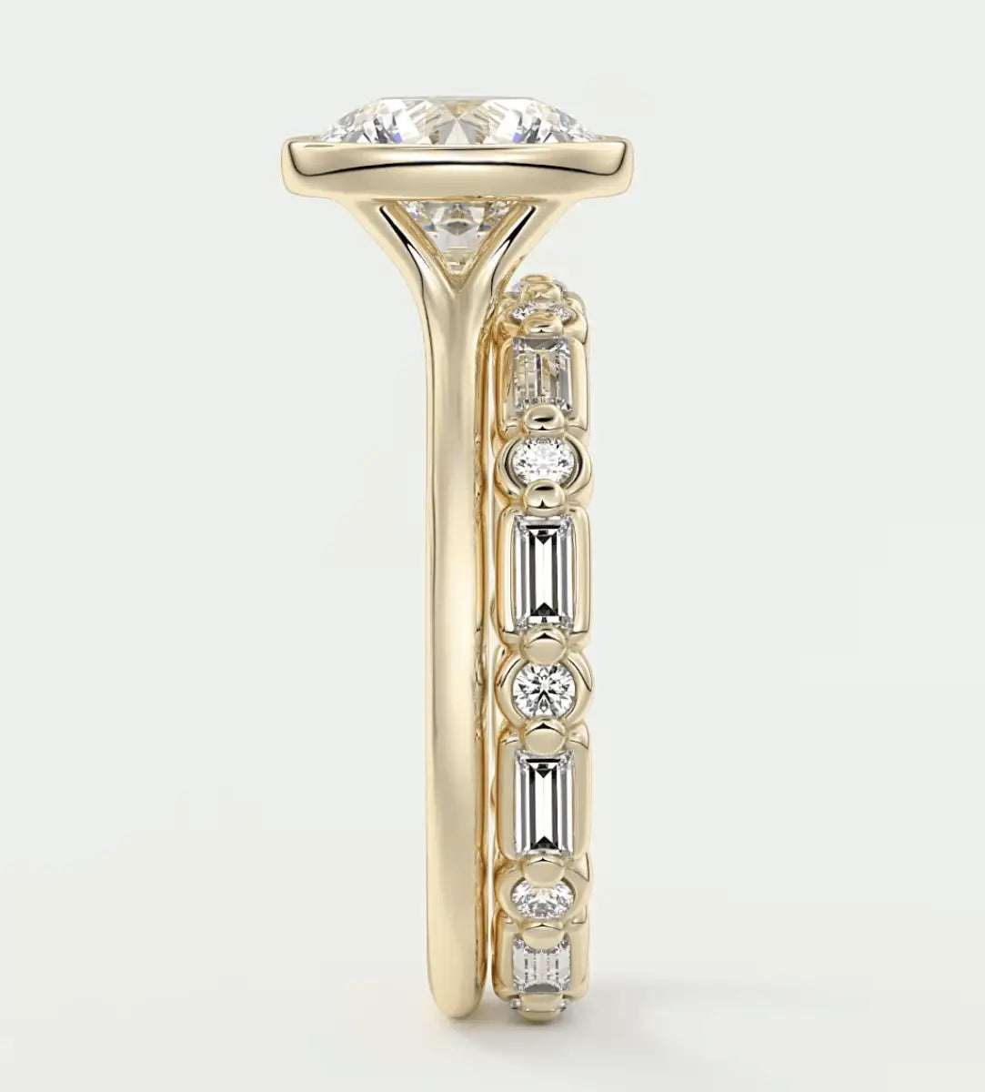 18k yellow gold diamond engagement ring with a cushion-cut center stone and baguette side stones.