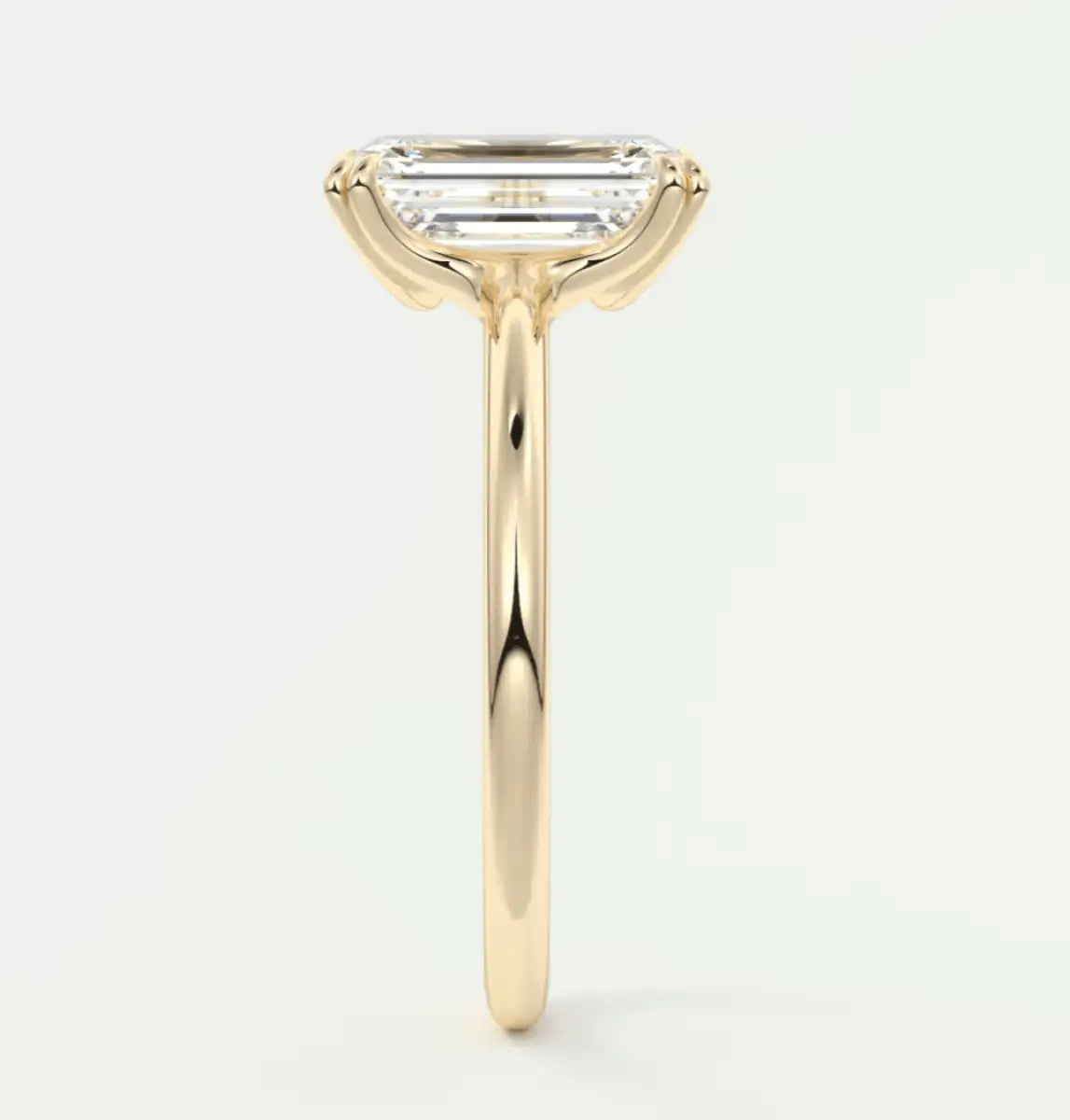 18k yellow gold emerald cut diamond engagement ring.