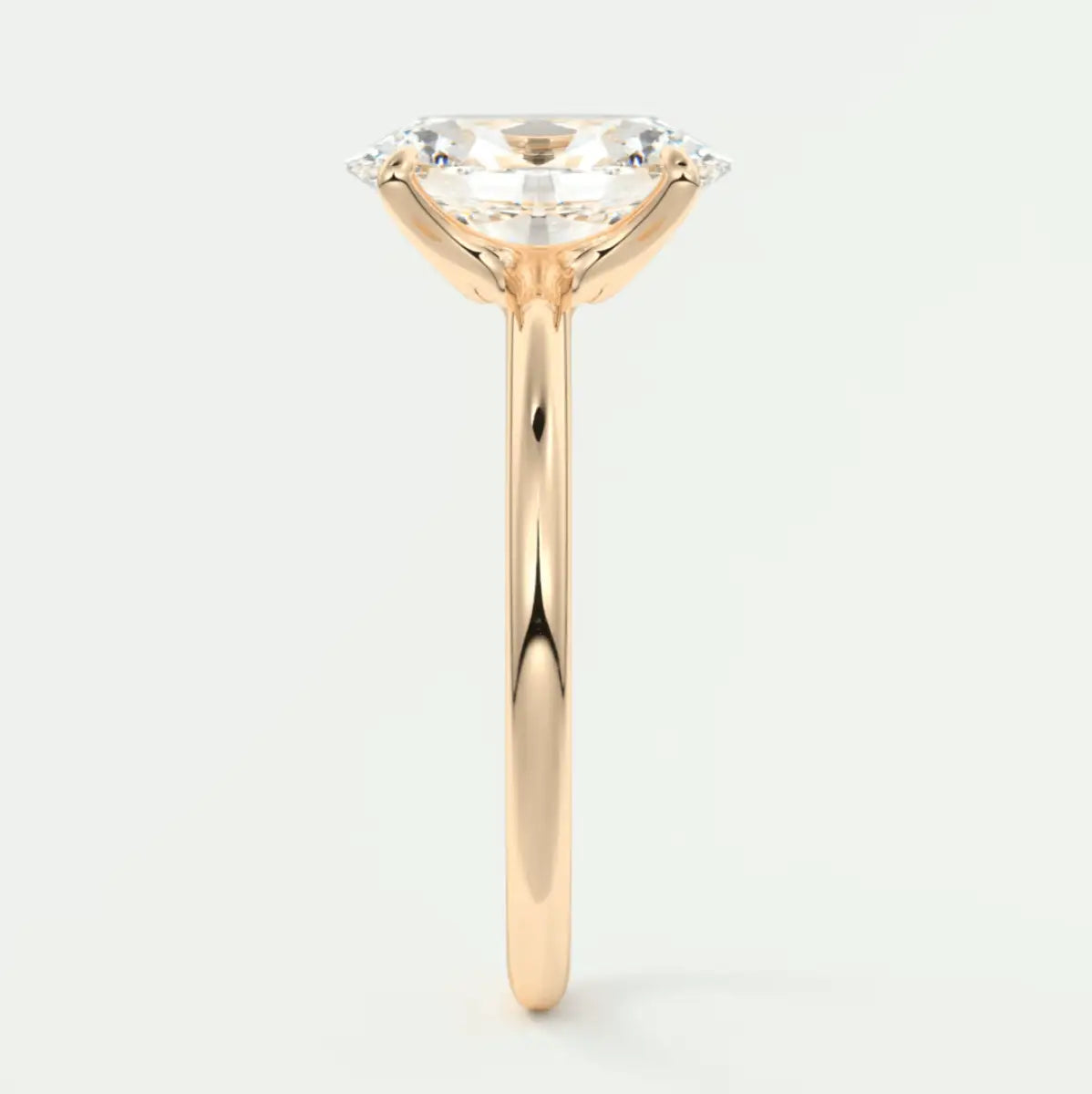 18-karat yellow gold engagement ring with a cushion-cut diamond and small accent diamonds.