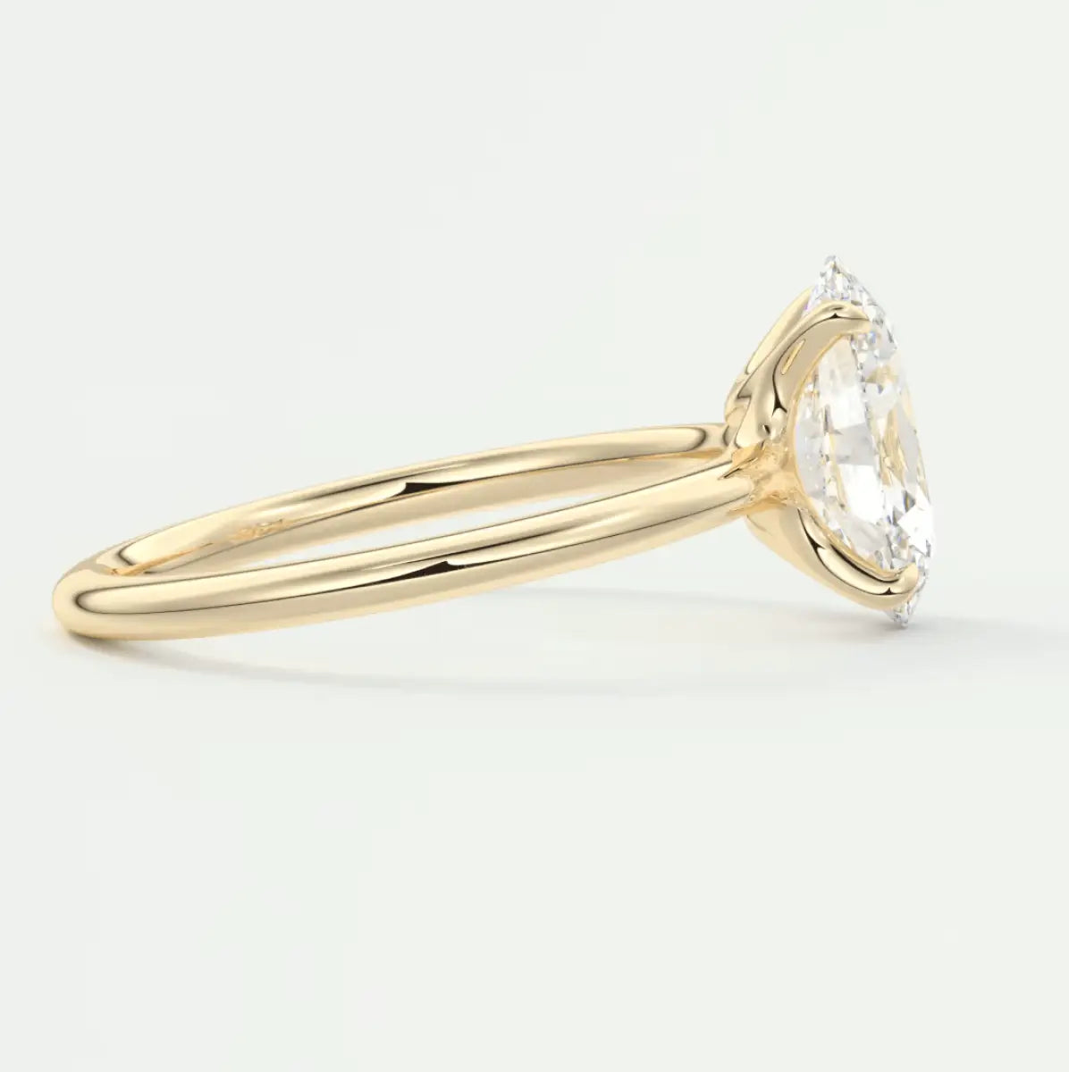 18k yellow gold solitaire engagement ring with a round diamond.