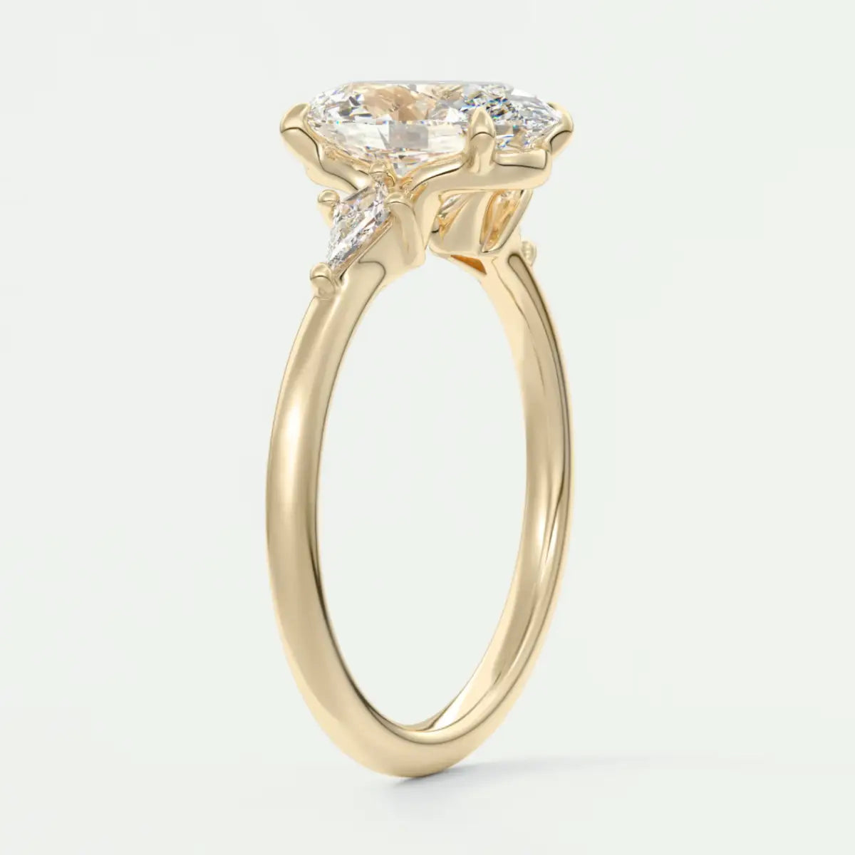 Custom made elysian oval three-stone engagement ring with kite side stones | diamond lab