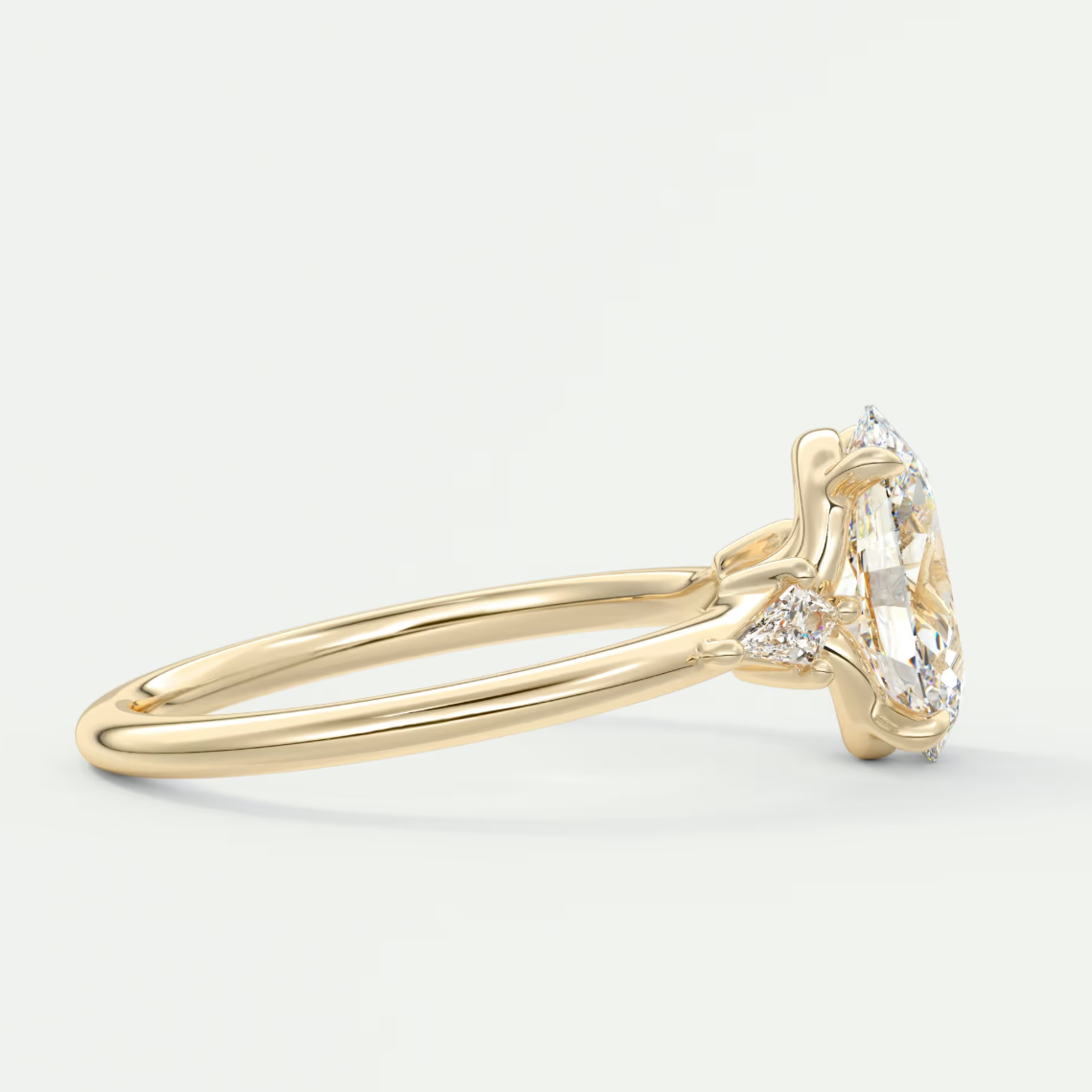 Custom made elysian oval three-stone engagement ring with kite side stones | diamond lab