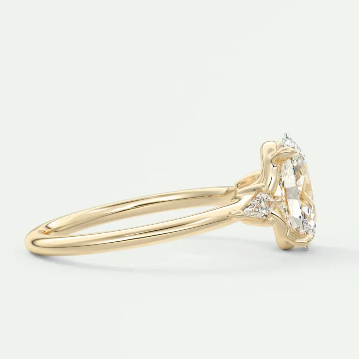 Custom made elysian oval three-stone engagement ring with kite side stones | diamond lab