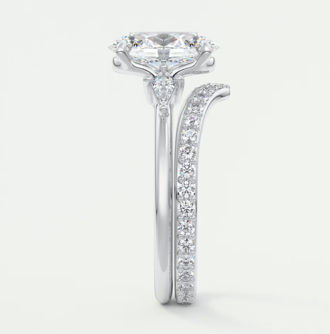 Custom made elysian oval three-stone engagement ring with kite side stones | diamond lab