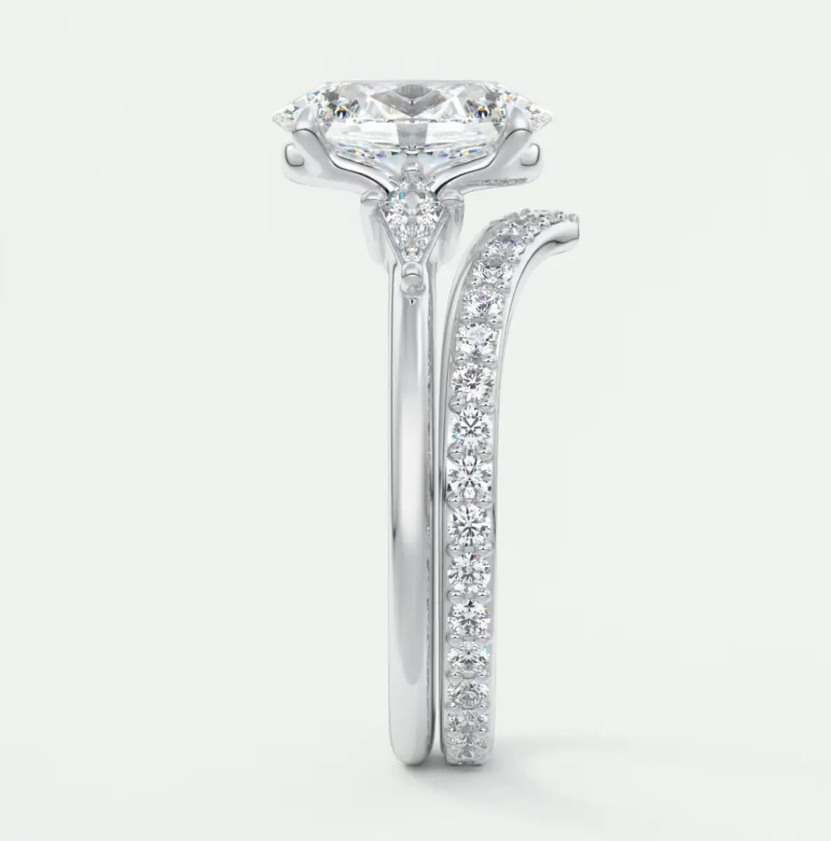 Custom made elysian oval three-stone engagement ring with kite side stones | diamond lab