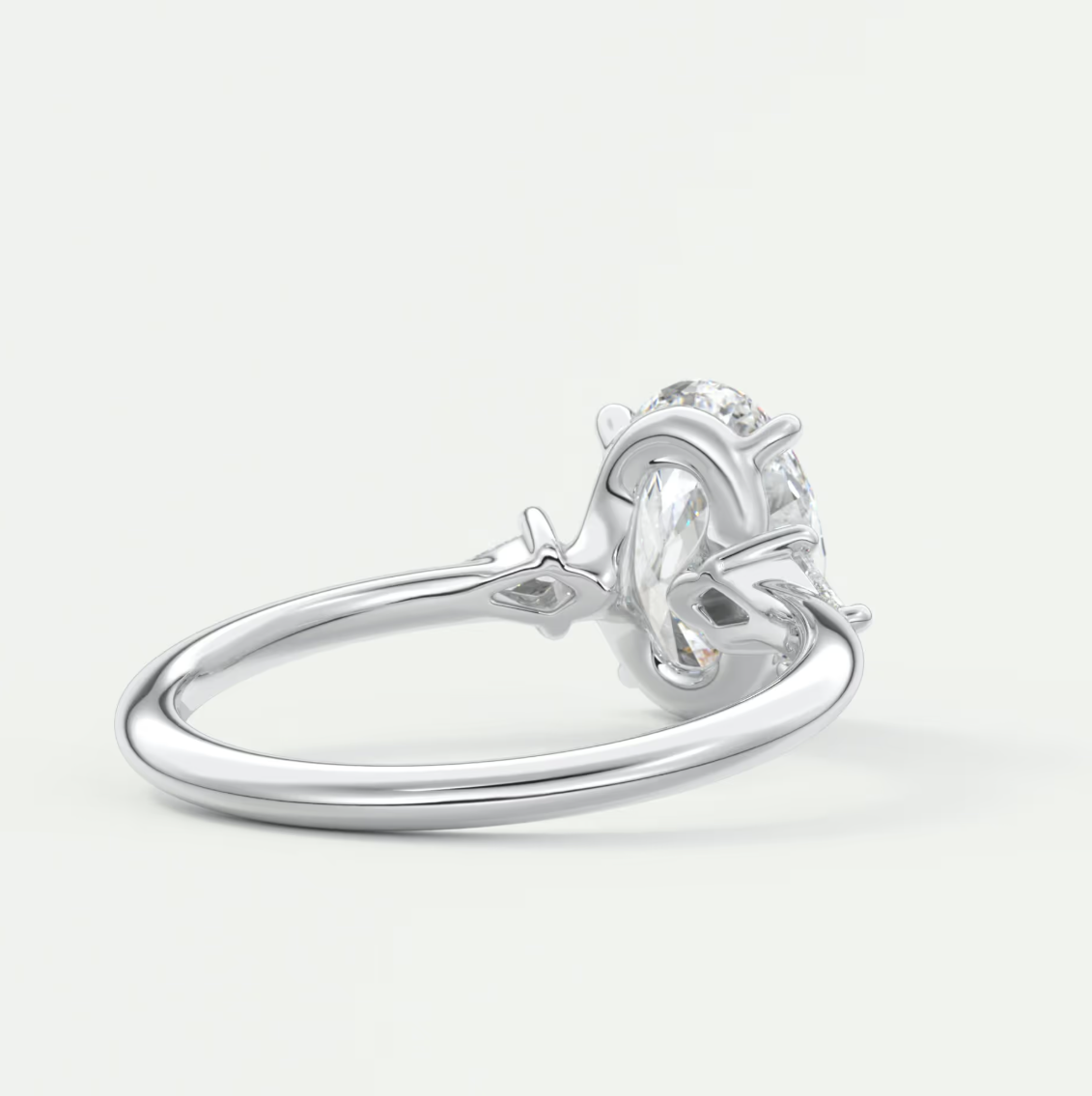 Custom made elysian oval three-stone engagement ring with kite side stones | diamond lab