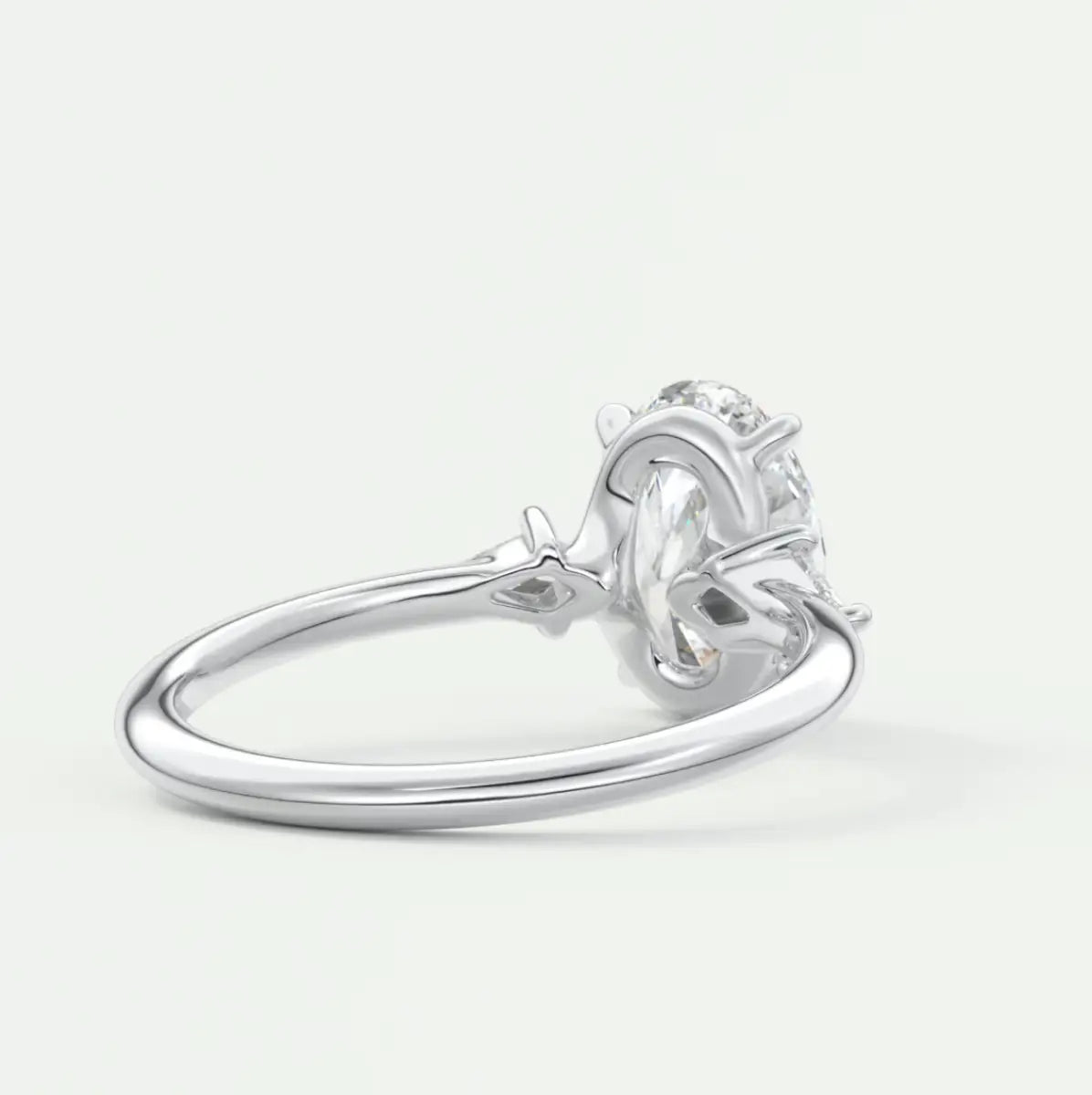 Custom made elysian oval three-stone engagement ring with kite side stones | diamond lab