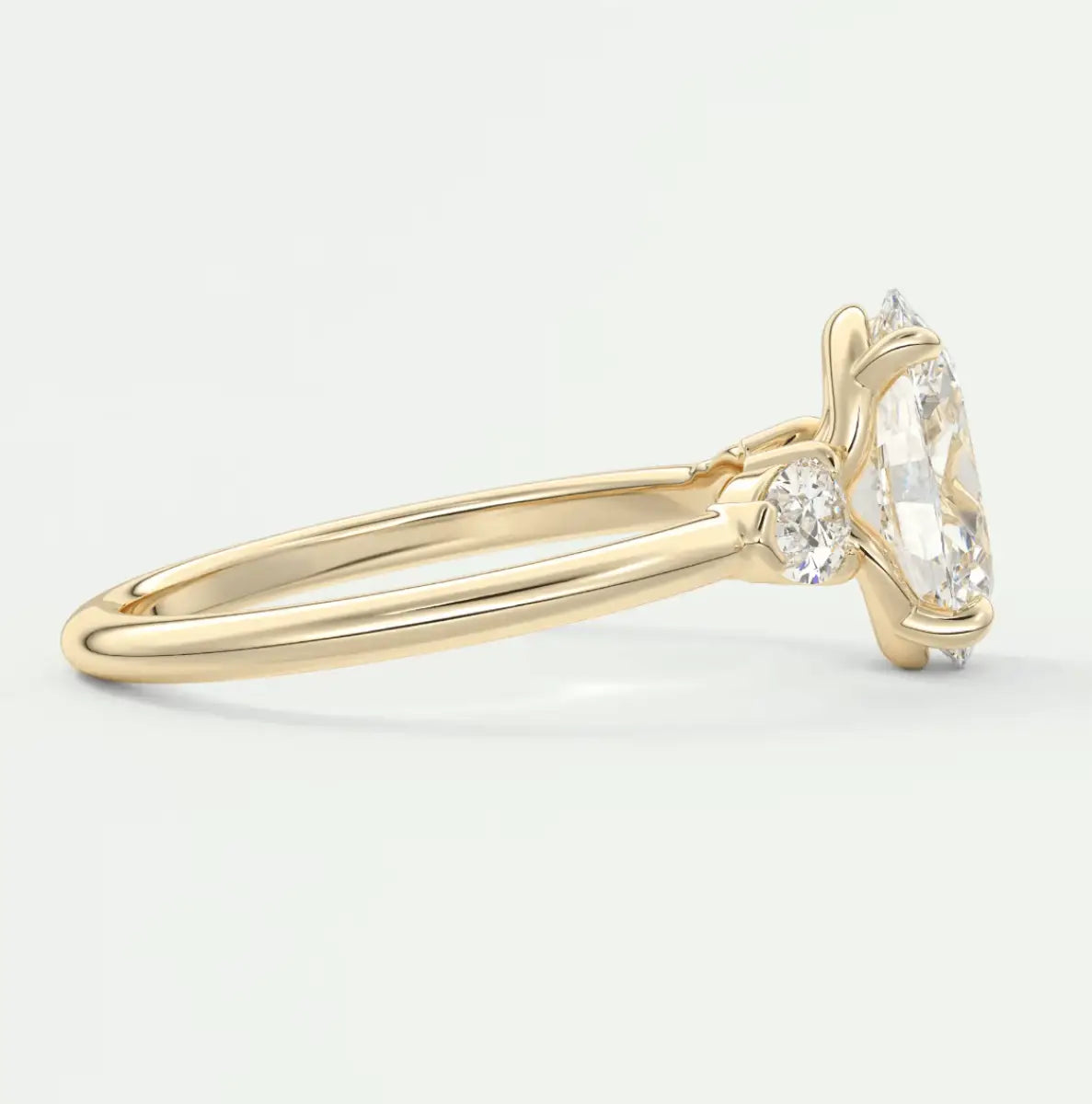 18k yellow gold engagement ring with a marquise-cut diamond.