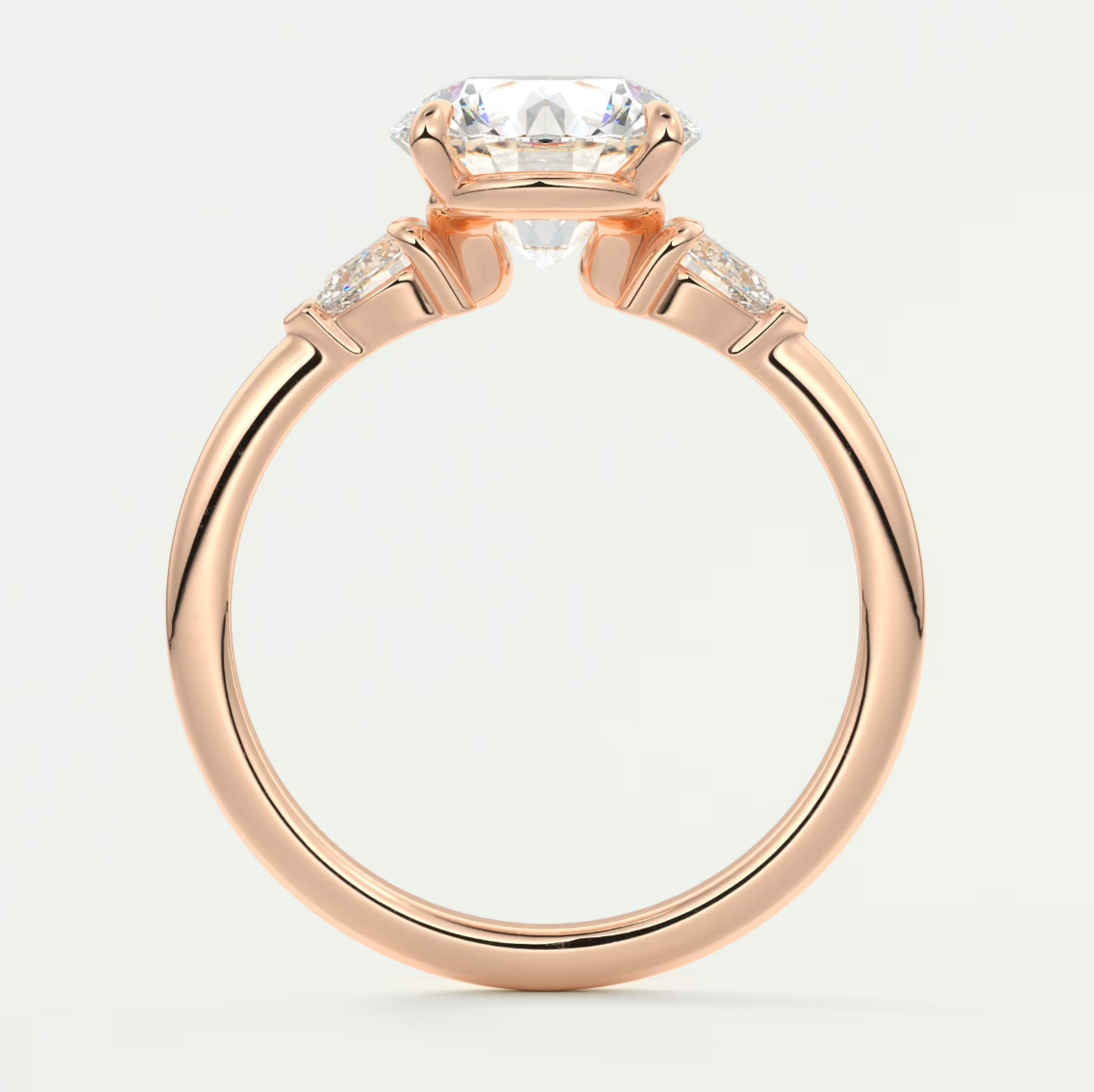 Custom made elysian round three-stone engagement ring with pear side stones | diamond lab