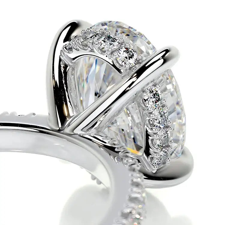 Close-up of a silver ring with diamond accents on a white background
