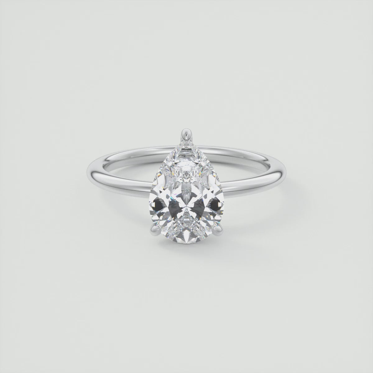 Celestia Pear Hidden Halo Ring – Lab Diamond or Moissanite