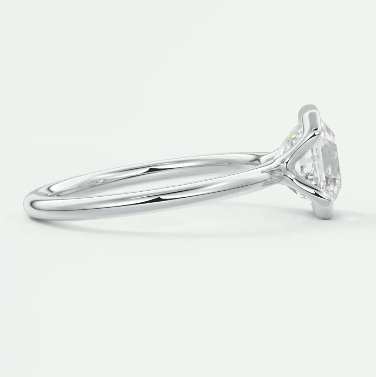 18k white gold engagement ring with a round diamond.