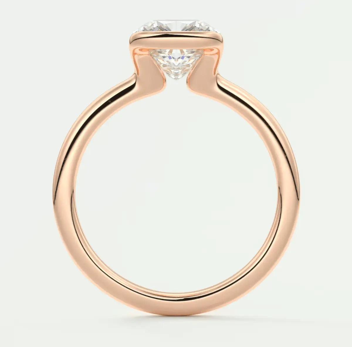 18-karat rose gold engagement ring with a round diamond.