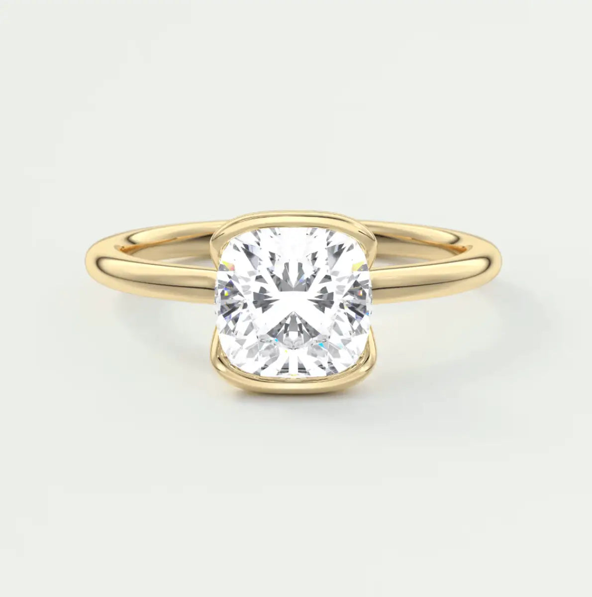 Cushion-cut diamond engagement ring with yellow gold band, featuring a princess cut gemstone.