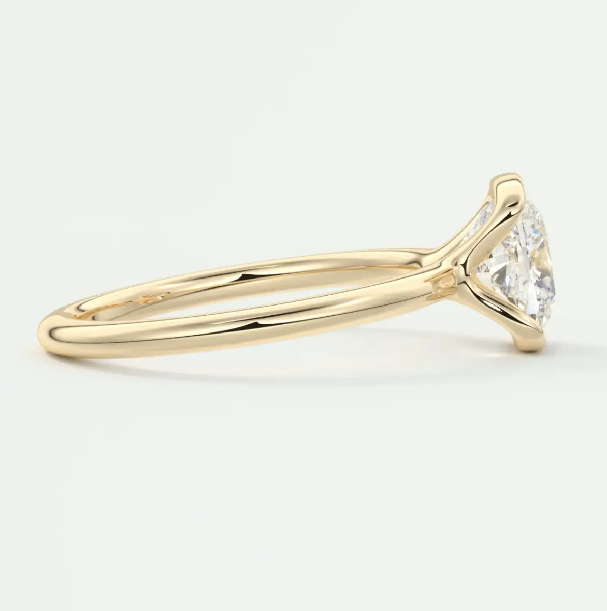 18k yellow gold engagement ring with a marquise-cut diamond.