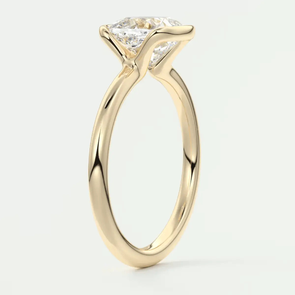 18k yellow gold engagement ring with a princess cut diamond.