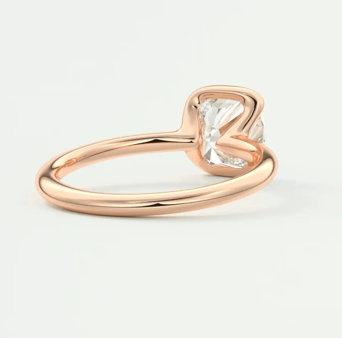 Rose gold engagement ring with a princess cut diamond.