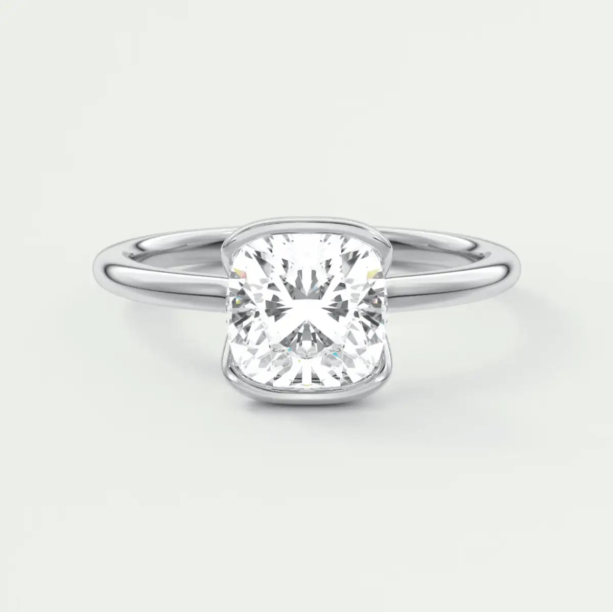 Cushion-cut diamond engagement ring with a white gold band.