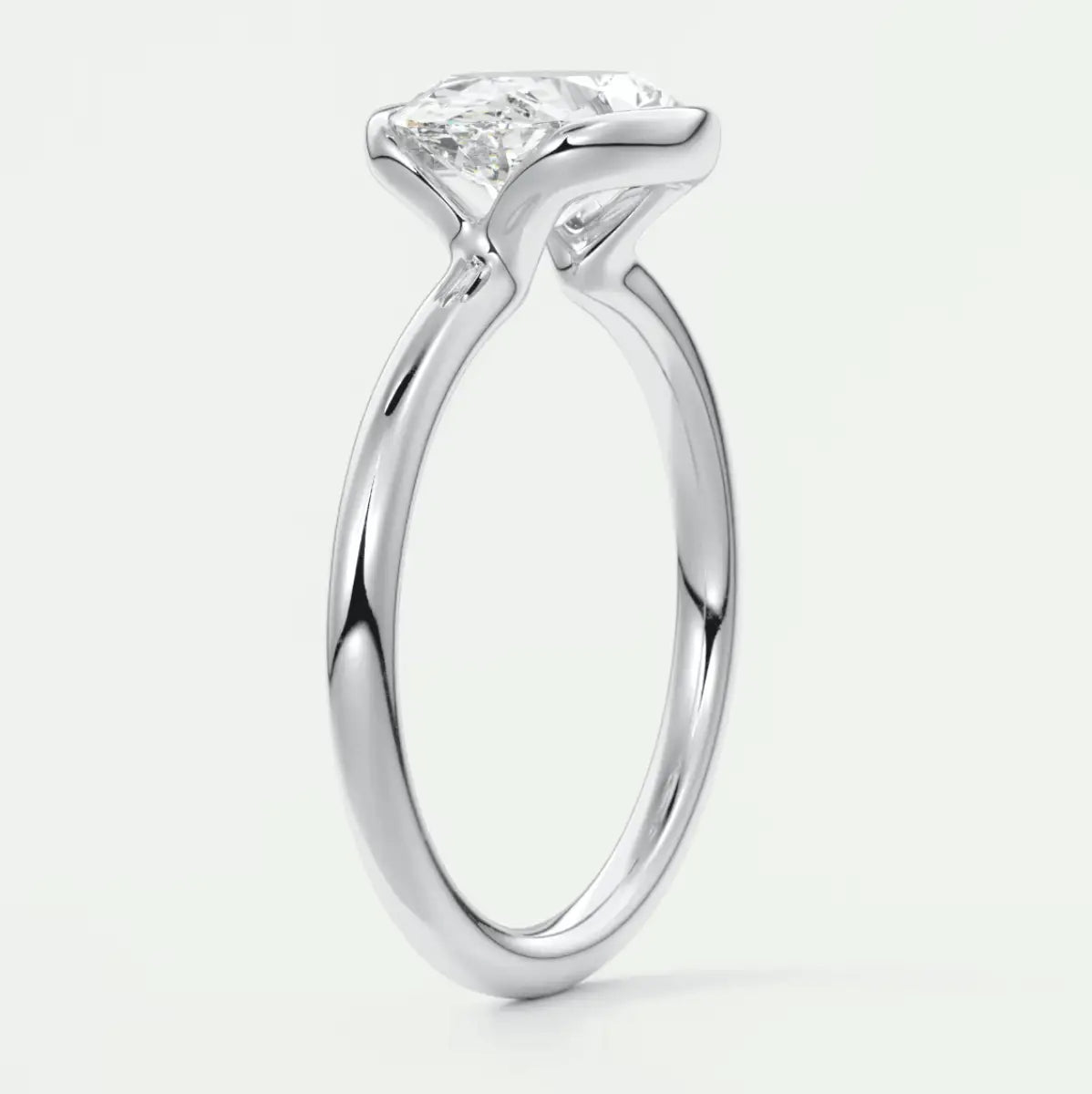 18-karat white gold engagement ring with a princess-cut diamond.