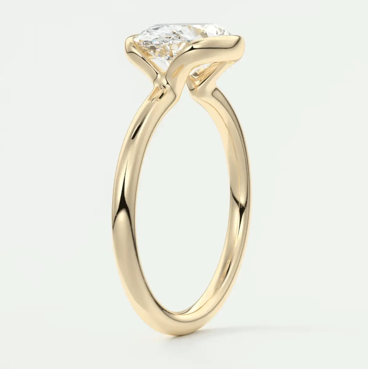 18k yellow gold engagement ring with a princess cut diamond.