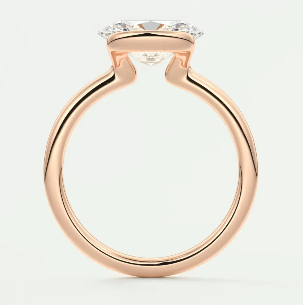 Rose gold diamond engagement ring with a cushion-cut center stone and halo detailing.