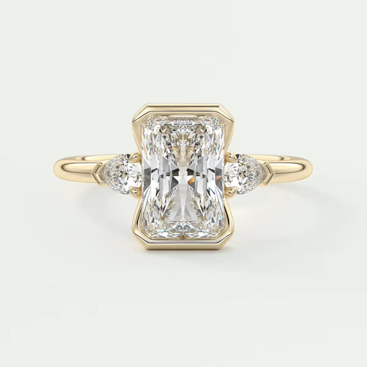 Custom made solara elongated radiant half bezel three-stone engagement ring | diamond lab