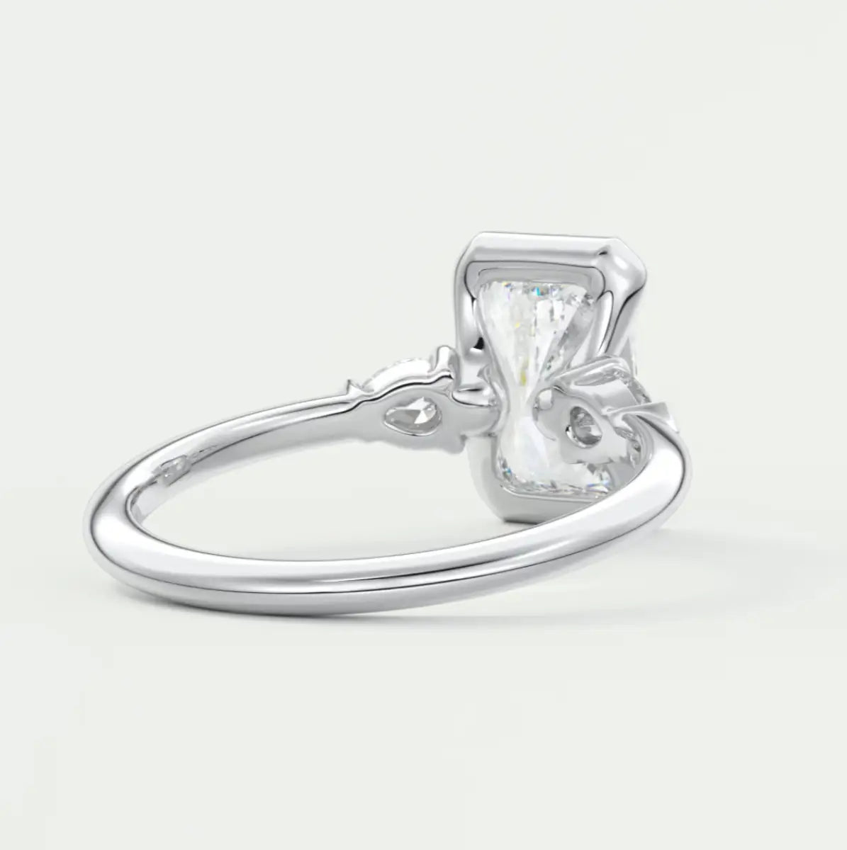 Custom made solara elongated radiant half bezel three-stone engagement ring | diamond lab