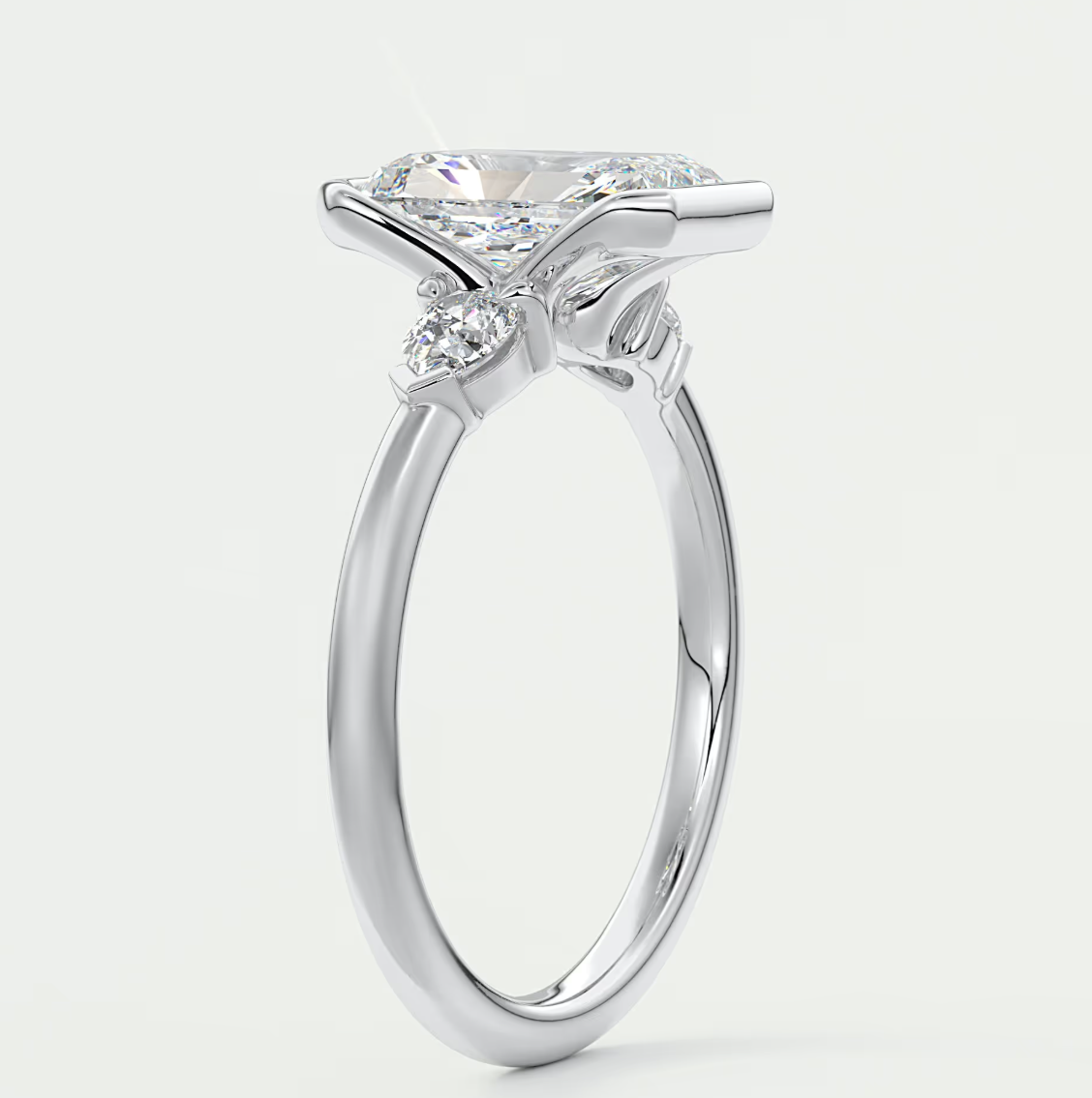 Custom made solara elongated radiant half bezel three-stone engagement ring | diamond lab