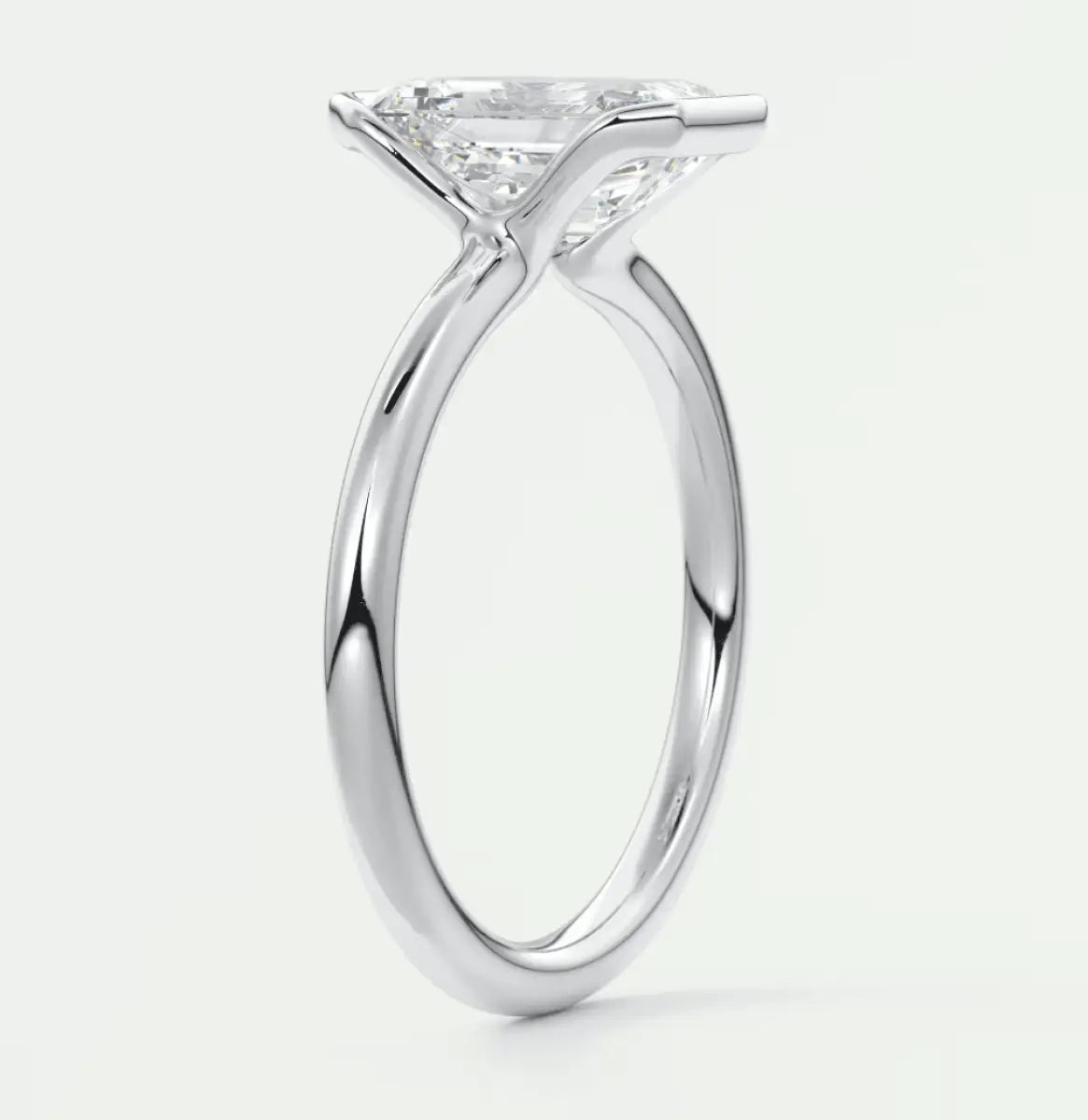 18-karat white gold princess-cut diamond engagement ring.