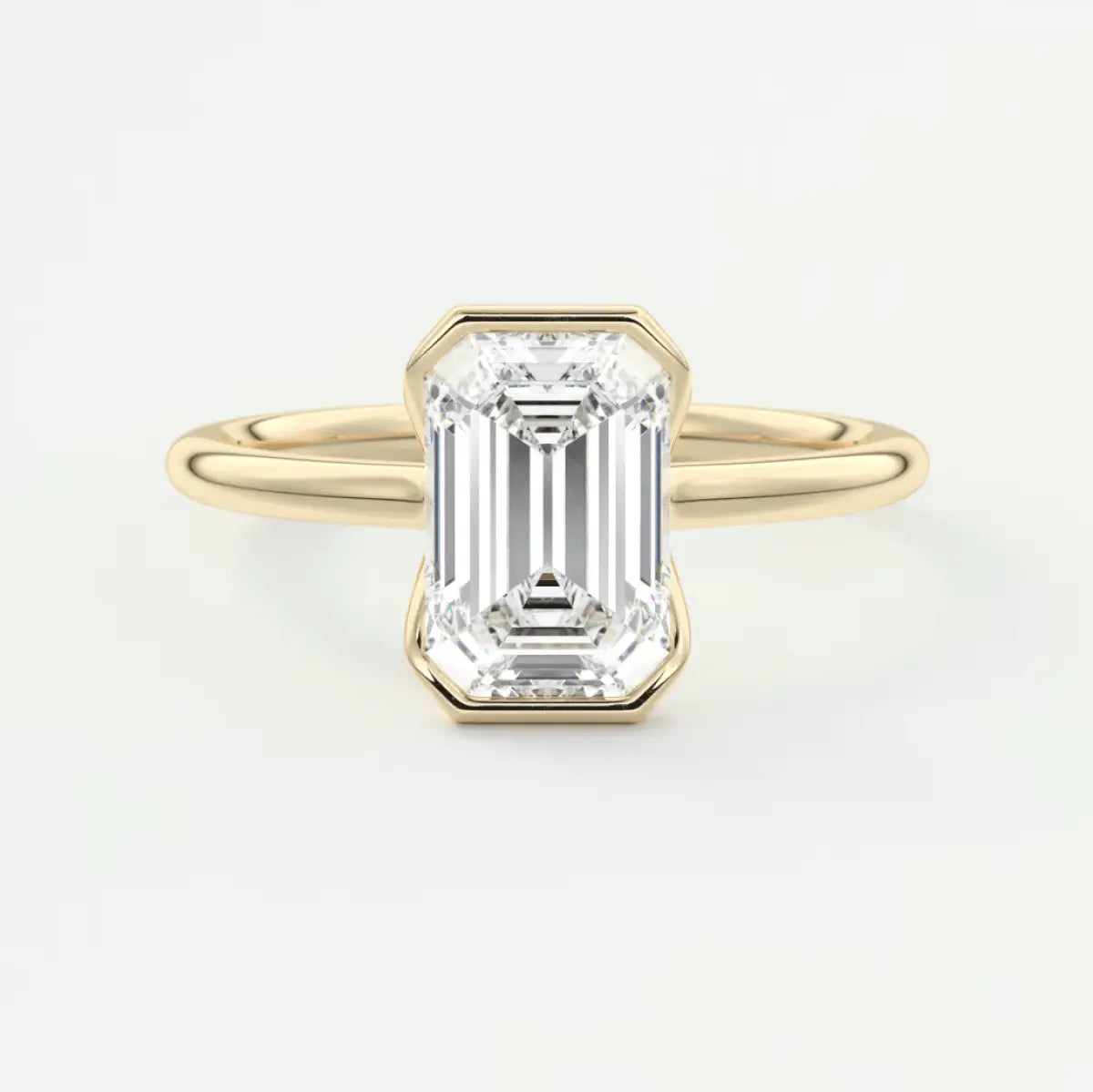 18k yellow gold emerald cut diamond engagement ring.
