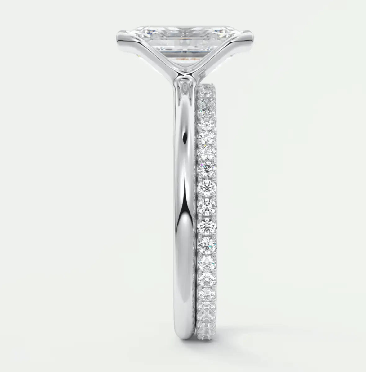 18k white gold princess cut diamond engagement ring with a pave band.