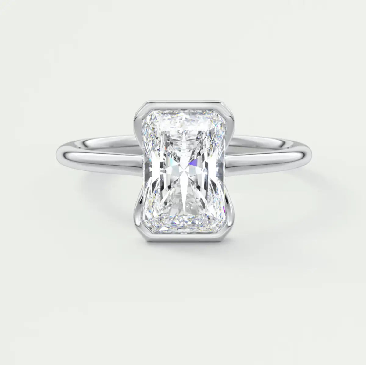 18k white gold engagement ring with a radiant cut diamond.