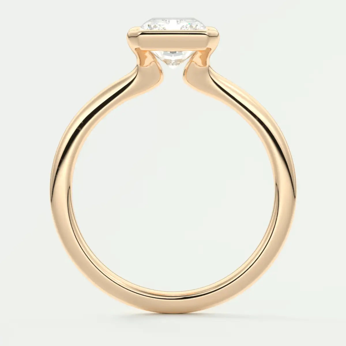 18-karat gold engagement ring with a round diamond.