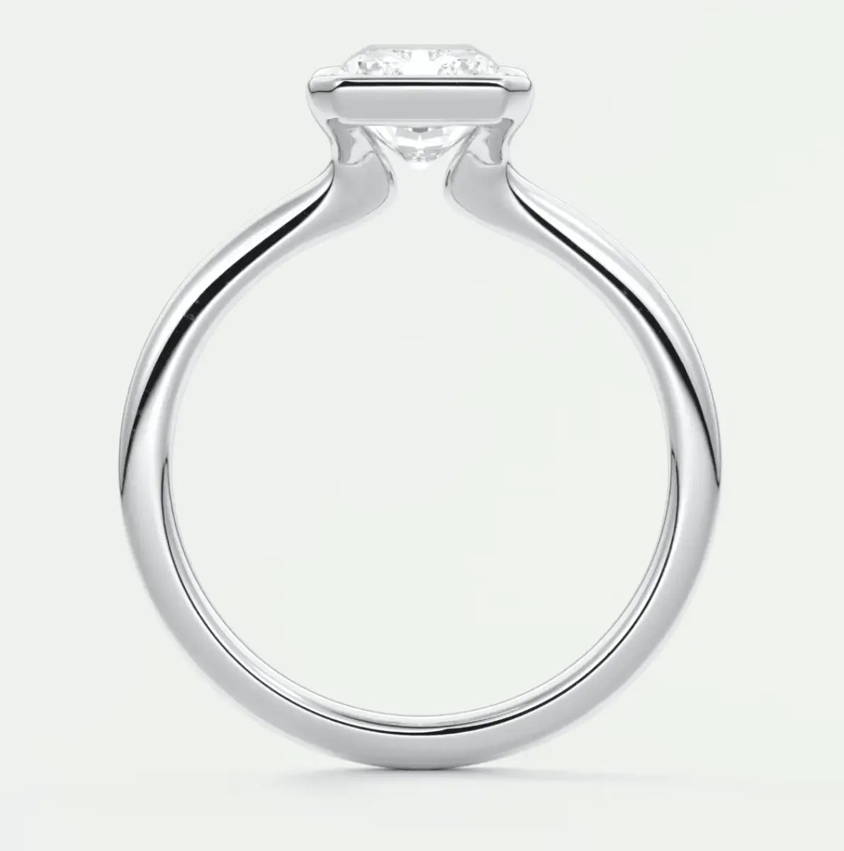 Silver diamond engagement ring with a twisted band design.