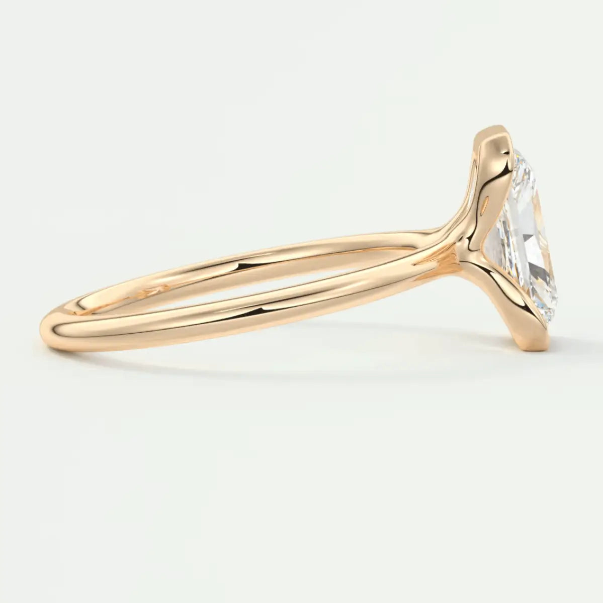 18k rose gold engagement ring with a princess cut diamond.