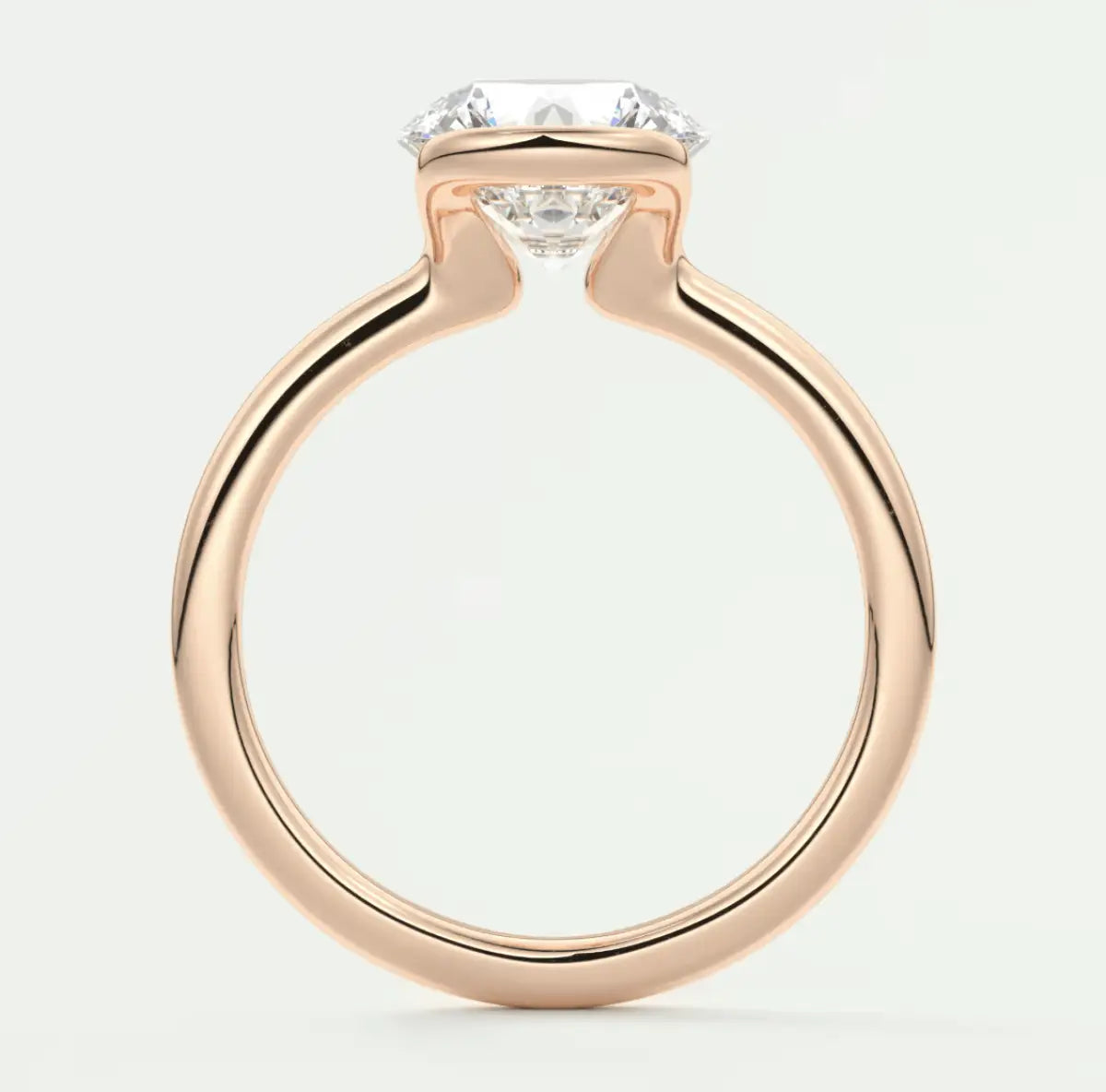 Rose gold diamond engagement ring with a cushion-cut center stone and prong setting.