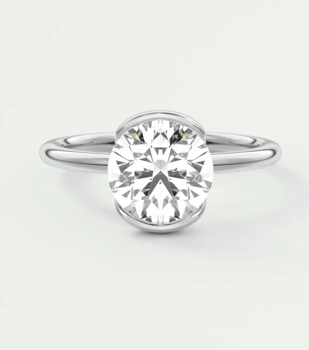18-karat white gold solitaire diamond engagement ring.