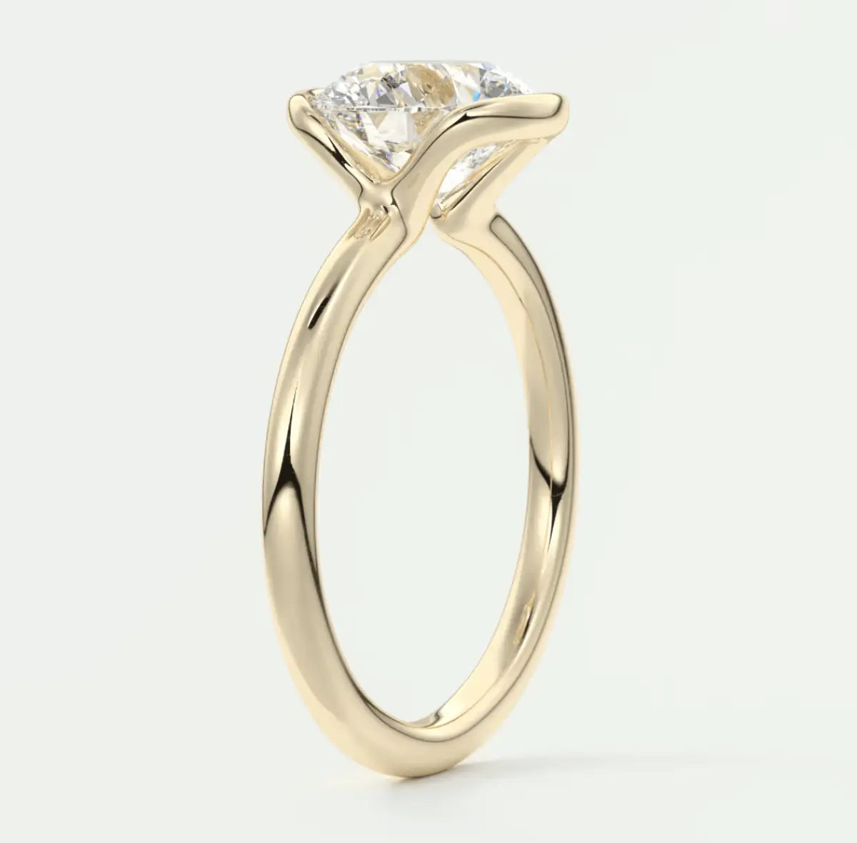 18-karat yellow gold solitaire engagement ring with a princess-cut diamond.