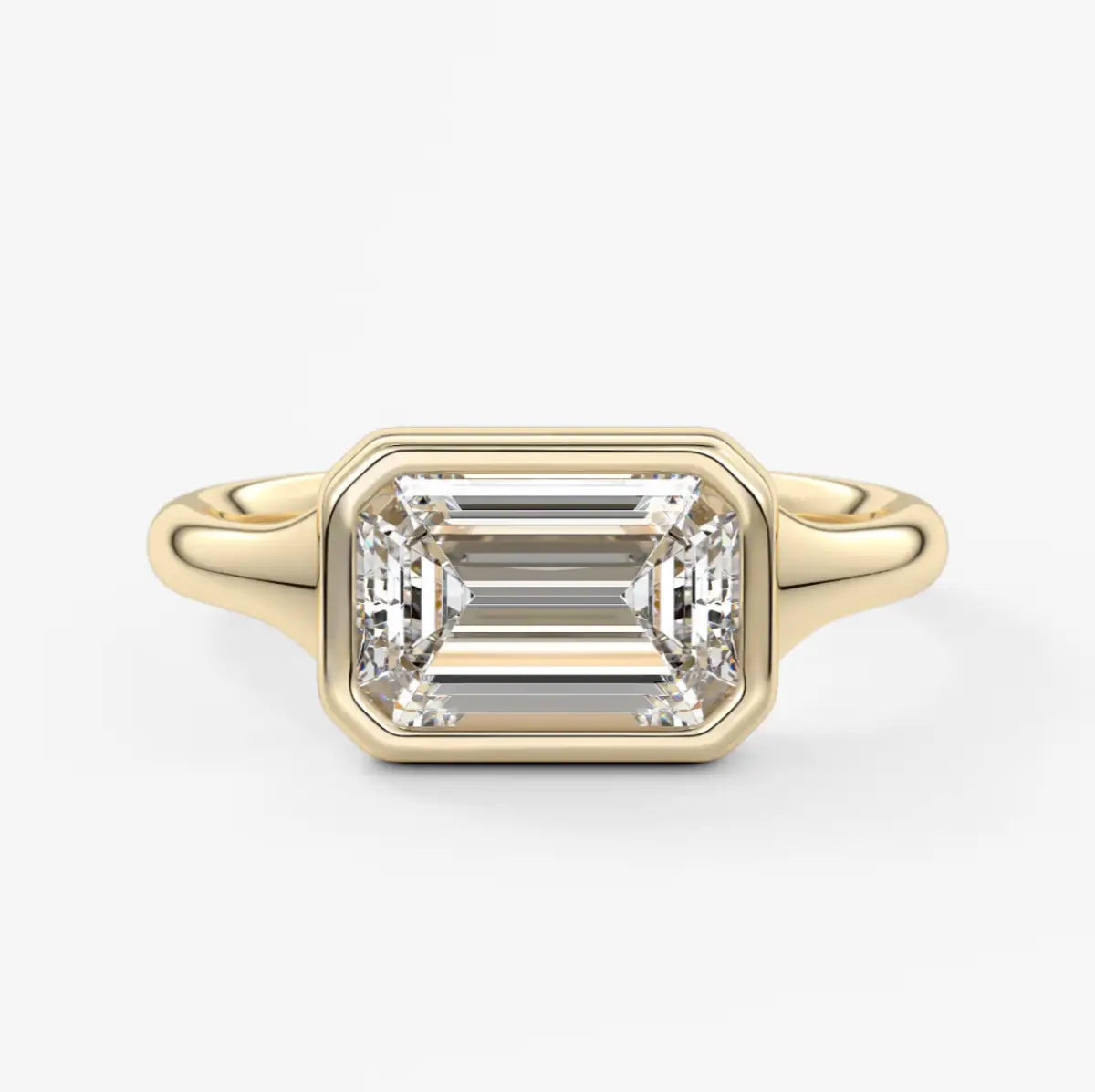 18-karat yellow gold emerald-cut diamond engagement ring.