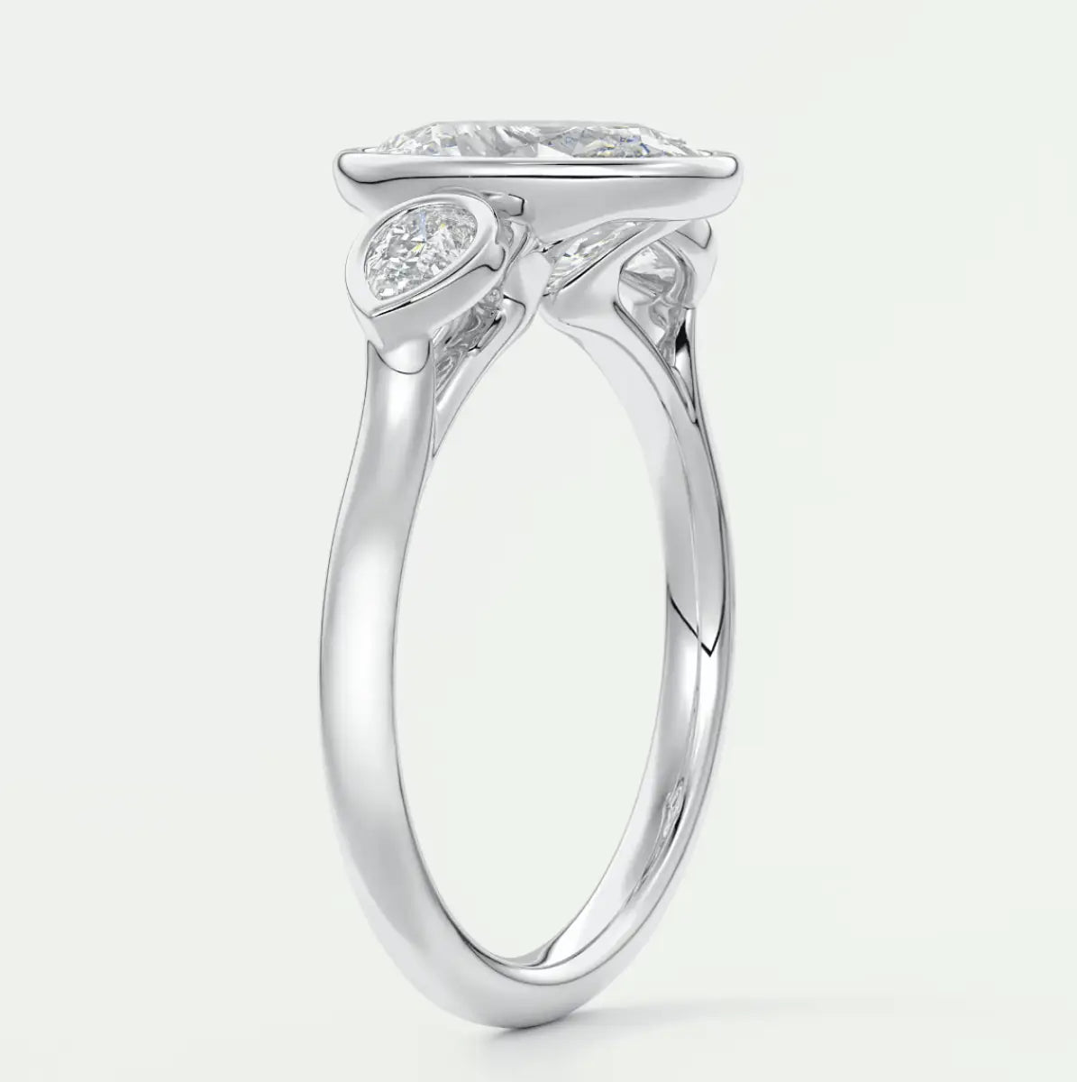 18k white gold engagement ring with a cushion-cut diamond and small accent diamonds.
