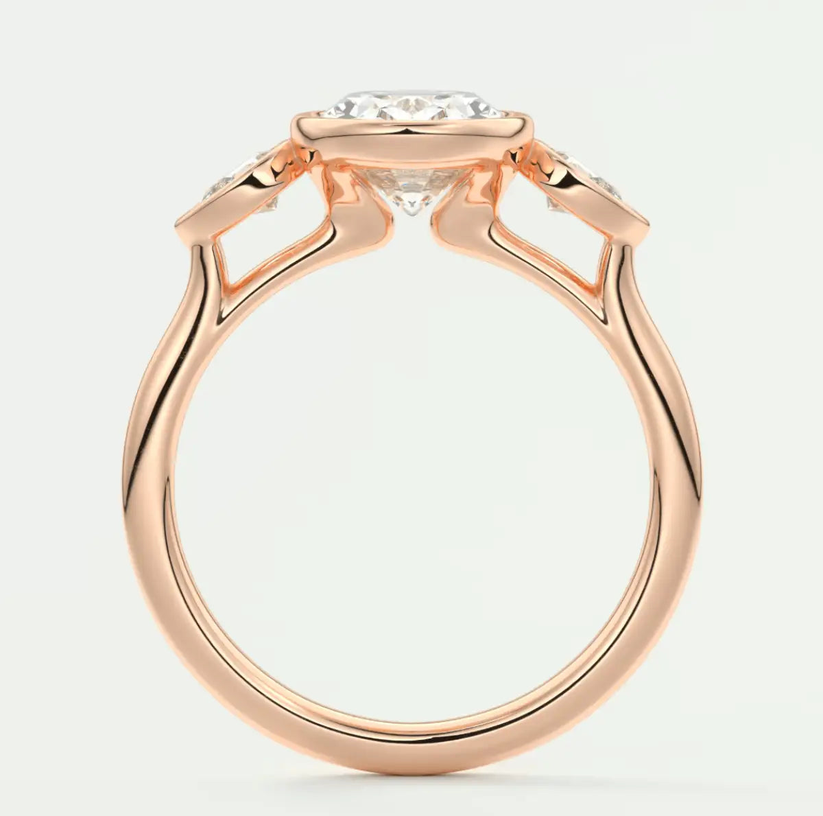 Rose gold diamond engagement ring with a marquise-cut center stone and delicate leaf-inspired band design.
