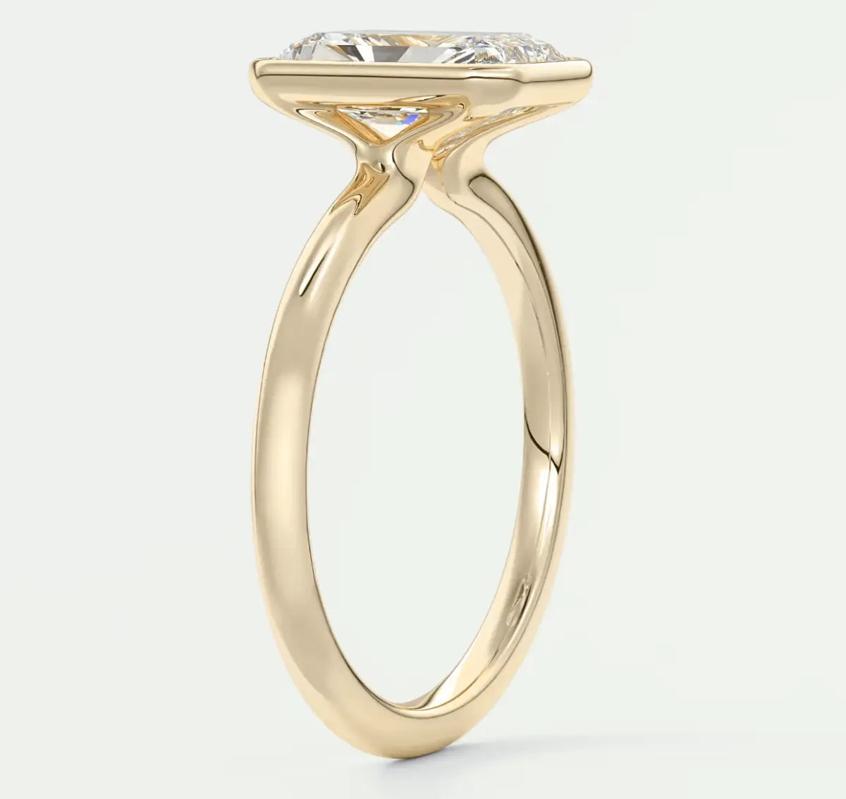 18k yellow gold engagement ring with a marquise-cut diamond.